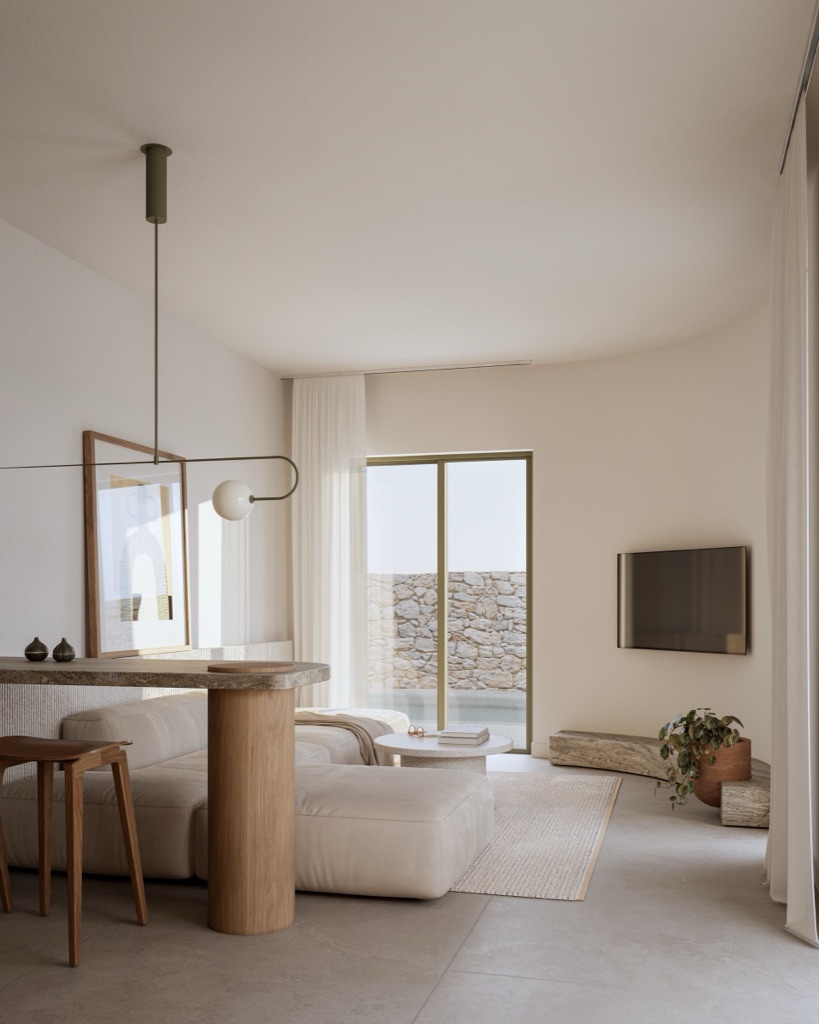 Pale living room with travertine table and linen sofa.