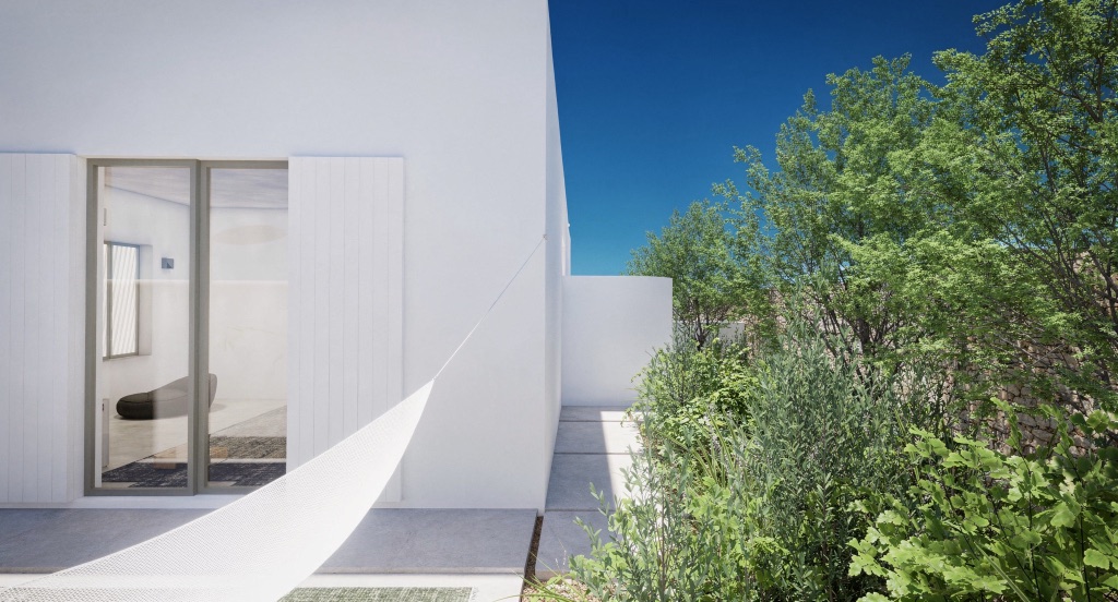 A tall glass slider in white render, framed by olive trees and Mediterranean shrub.