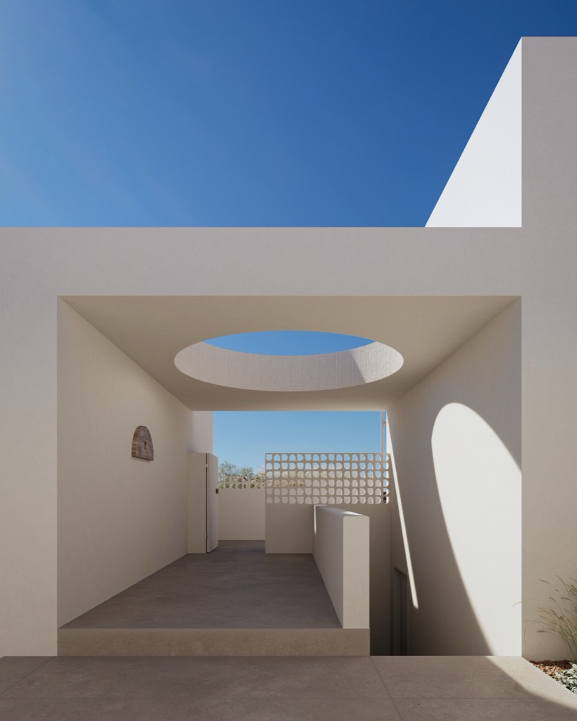 A circular oculus opening to the Aegean sky.